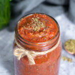 Pinterest pin with text overlay 'Pizza Sauce Ready in under 5 Minutes'. Image of jar filled to the top with pizza sauce.