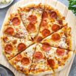 Pinterest Pin with text "Homemade Pizza", image of a cooked pizza.