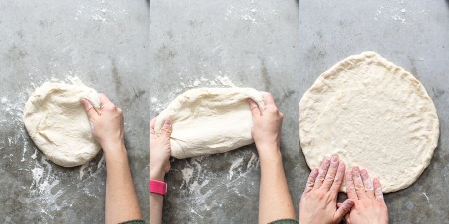 Prepping the pizza dough by stretching it our into a circle.