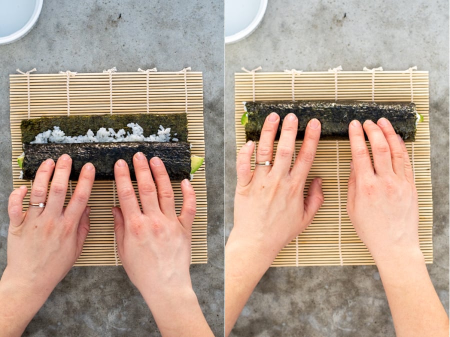 Steps 6 of a California roll, rolling up the seaweed nori around the fillings.
