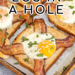 Pinterest Pin with text overlay 'Sheet Pan Egg in a Hole', image of a sheet pan with a close shot of a baked egg in a hole toast with bacon.