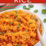 Pinterest Pin with overlay 'Mexican Rice' image of a large white bowl filled with mexican rice and garnished with cilantro.