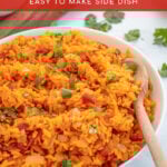 Pinterest Pin with overlay 'Mexican Rice' image of a large white bowl filled with mexican rice and garnished with cilantro.