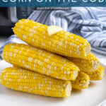 Pinterest Pin with text 'Instant Pot Corn on the Cob', image of a stack of cooked corn on a plate.