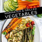 Pinterest pin with text 'Marinated & Grilled Vegetables', image of a platter filled with freshly grilled veggies laid out nicely on a platter.