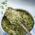 Pinterest Pin with text 'Homemade Ranch Seasoning Mix', image of a small bowl holding the ranch mix.