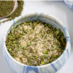 Pinterest Pin with text 'Homemade Ranch Seasoning Mix', image of a small bowl holding the ranch mix.