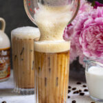 Pinterest Pin with text overlay 'Salted Maple Cold Brew', image of a glass of cold brew with a foam top.