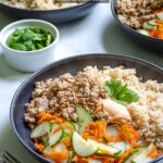 Pinterest Pin with text 'Banh Mi Bowls' with image of bowls of ground pork, brown rice, and quick pickled vegetables.
