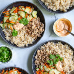 Pinterest Pin with text 'Banh Mi Bowls' with image of bowls of ground pork, brown rice, and quick pickled vegetables.