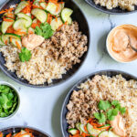 Pinterest Pin with text 'Banh Mi Bowls' with image of bowls of ground pork, brown rice, and quick pickled vegetables.