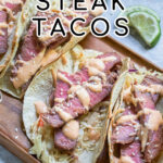 Pinterest Pin with text overlay 'Tuna Steak Tacos' images of a tray full of seared tuna tacos with garnishes.