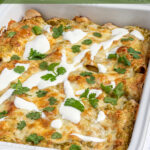 Pinterest Pin with text 'Green Chicken Enchiladas', image of white baking dish filled with green enchiladas.