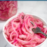 Pinterest Pin with text 'Quick Pickled Red Onions' with image of white bowl of red quick pickled onions with a fork.