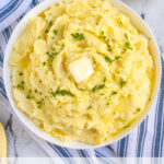 Pinterest Pin with text 'Mashed Potatoes Stovetop or Instant Pot Instructions', image of a large bowl of classic mashed potatoes with melted butter.