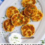 Pinterest Pin with text 'Leftover Mashed Potato Cakes', image showing golden brown leftover mashed potato cakes on a platter with fresh parsley.