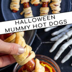 Pinterest Pin with text 'Halloween Mummy Dogs', image of mummy dogs with mustard eyes on a black plate.