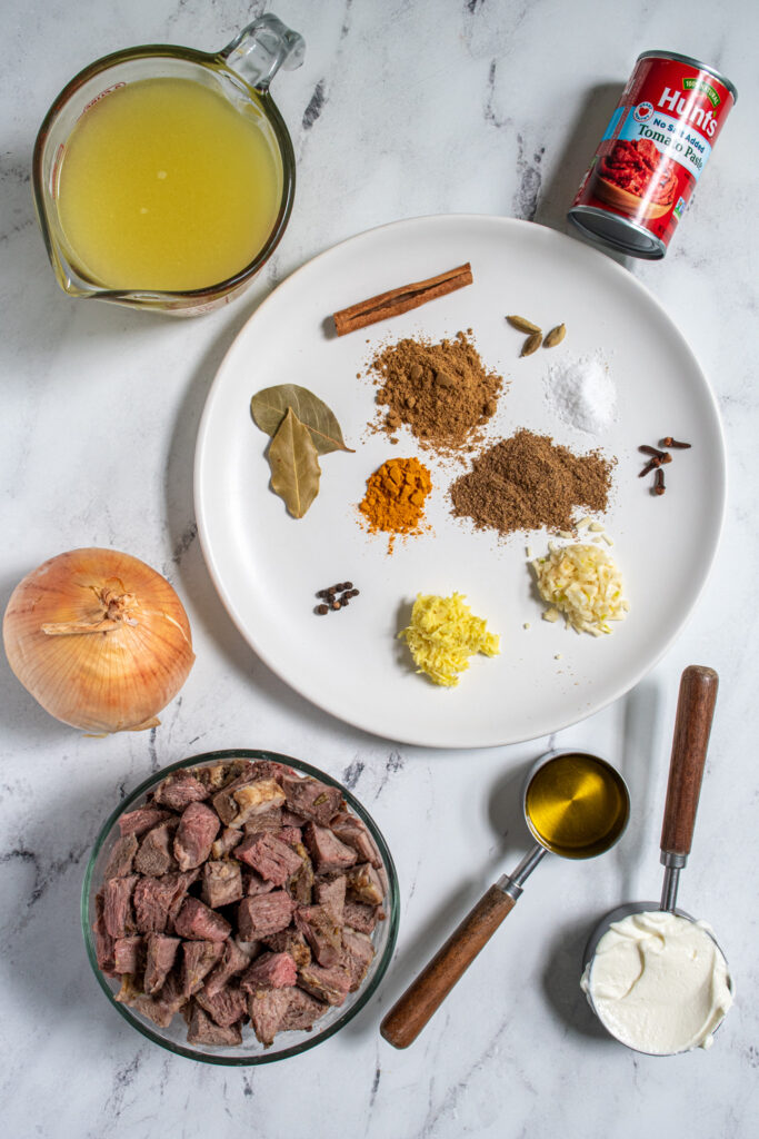 Ingredients for leftover lamb curry laid out on a tabletop.