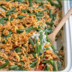 Pinterest Pin with text "Green Bean Casserole with Bacon", image of white casserole dish filled with fresh green bean casserole.