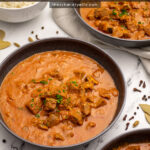 Pinterest Pin with text 'Leftover Lamb Curry', image of three black bowls filled with curry garnished with parsley.