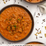 Pinterest Pin with text 'Leftover Lamb Curry', image of three black bowls filled with curry garnished with parsley.