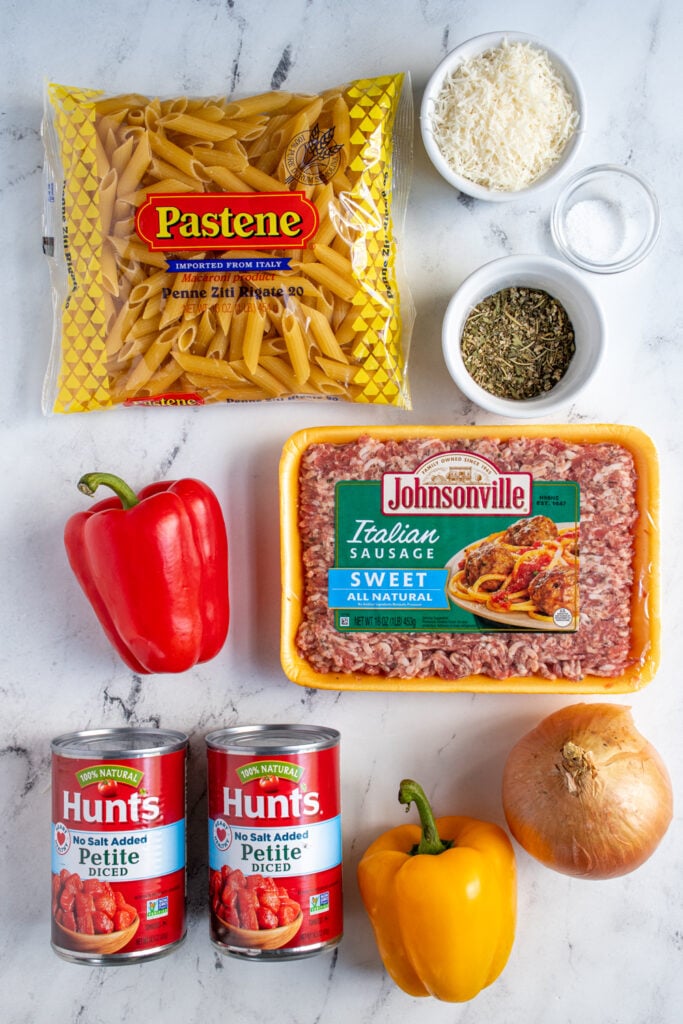 Ingredients for Sausage Pepper Pasta laid out on a tabletop.