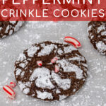 Pinterest Pin with text 'Chocolate Peppermint Crinkle Cookies', image of a bunch of chocolate peppermint crinkle cookies laid out on pice of parchment paper.