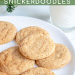 Pinterest Pin with text overlay 'Eggnog Snickerdoodles', image of a white plate full of snickerdoodles with a sugary cinnamon nutmeg outside.