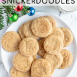 Pinterest Pin with text overlay 'Eggnog Snickerdoodles', image of a white plate full of snickerdoodles with a sugary cinnamon nutmeg outside.