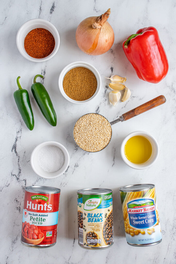 Ingredients needed to make southwest quinoa laid out on a tabletop.