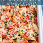 Pinterest pin with text 'Spinach Stuffed Shells without Ricotta', image of sauce and cheesy stuffed shells in a white casserole dish.