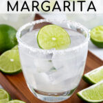 Pinterest Pin with text overlay 'How to make a Classic Margarita', image of a glass with a salted rim filled with a margarita and a lime wheel.