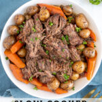 Pinterest Pin with text 'Slow Cooker Pot Roast', image of a serving bowl with chunks of pot roast, carrots, and baby potatoes.