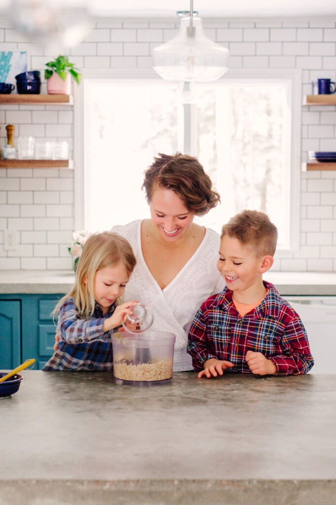 Lauren Schmidt with sons in kitchen.