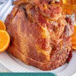 Pinterest pin with text 'Orange Bourbon Glazed Ham', images of glazed ham with oranges on a platter.