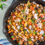 Pinterest pin with text overlay 'Turkey & Sweet Potato Skillet', image of turkey, sweet potatoes, and black beans in a cast iron skillet.
