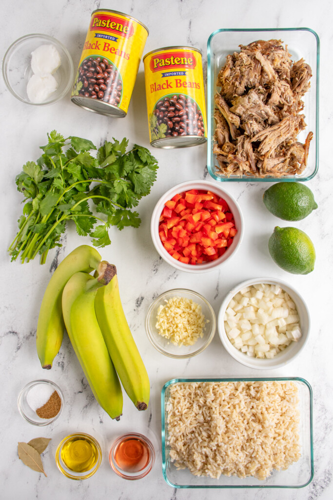 All the ingredients needed to make cuban rice bowls laid out on a tabletop.