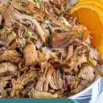 Pinterest Pin with text overlay 'Slow Cooker Cuban Mojo Pork', image of bowl of mojo pulled pork.