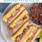 Pinterest Pin with text overlay 'Cuban sandwiches', image of a sandwich cut in half and stacked on top of each other showing off the insides.