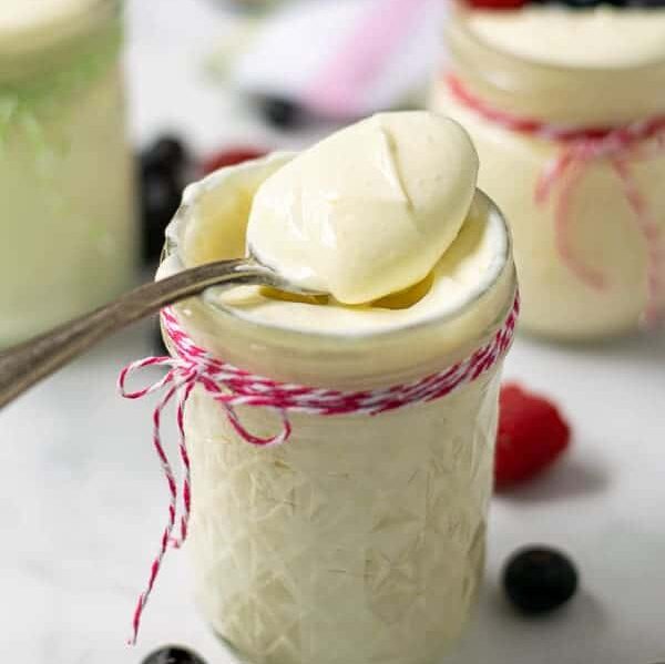 spoonful of lemon whipped greek yogurt in a jar