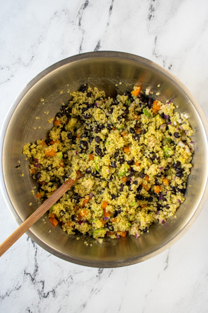 Mixing bowl filed with just mixed black bean quinoa salad.