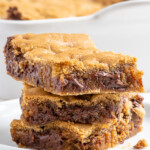 Pinterest pin with text overlay 'Whole Wheat Chocolate Chip Cookie Bars', image of a stack of 3 cookie bars on a white plate.