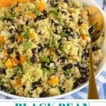 Pinterest Pin with text overlay 'Black bean Quinoa Salad with Orange Cilantro Dressing', image of a white bowl filled with black bean quinoa salad garnish with cilantro.