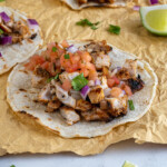 Pinterest Pin with text overlay 'Grilled Chicken Street Tacos', image of grilled chicken taco with toppings.