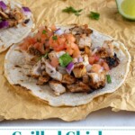 Pinterest Pin with text overlay 'Grilled Chicken Street Tacos', image of grilled chicken taco with toppings.