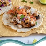 Pinterest Pin with text overlay 'Grilled Chicken Street Tacos', image of grilled chicken taco with toppings.