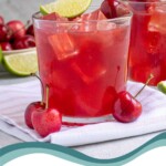 Pinterest pin with text overlay 'Fresh Cherry Margaritas', image of a glass with ice and a red cherry margarita.
