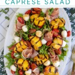 Pinterest pin with text overlay 'Grilled Peach Caprese Salad', image of a platter with grilled peach and mozzarella salad.