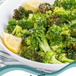 Pinterest pin with text overlay "Air Fryer Broccoli", image of a white bowl with cooked broccoli.