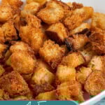 Pinterest pin with text overlay 'Air Fryer Croutons', image of golden brown crunchy croutons in a bowl.